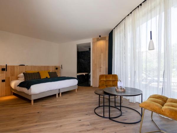A SPERANZA Suites avec piscine privative chauffée : photo 5 de la chambre suite junior avec baignoire spa et sauna - jardin et piscine chauffée privés