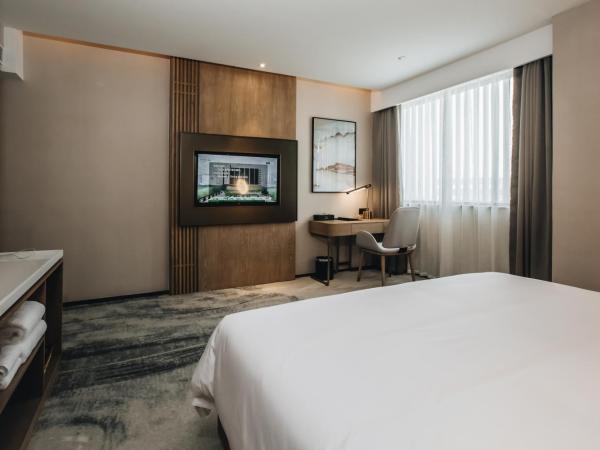 Orienwit Hotel-Free Shuttle Bus fir Canton Fair : photo 1 de la chambre chambre lit queen-size deluxe
