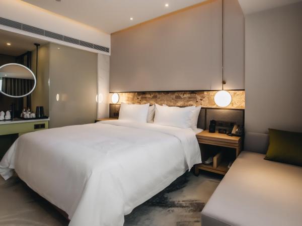 Orienwit Hotel-Free Shuttle Bus fir Canton Fair : photo 2 de la chambre chambre lit queen-size deluxe