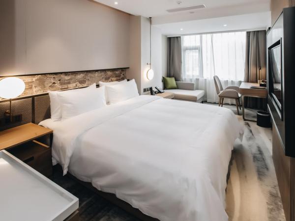 Orienwit Hotel-Free Shuttle Bus fir Canton Fair : photo 1 de la chambre chambre supérieure lit queen-size
