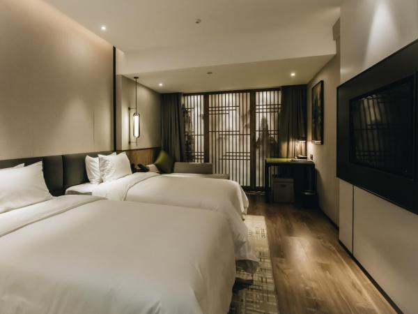 Orienwit Hotel-Free Shuttle Bus fir Canton Fair : photo 5 de la chambre chambre lits jumeaux supérieure