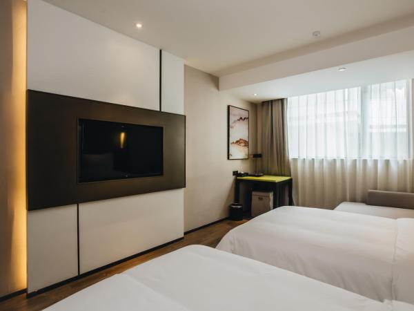 Orienwit Hotel-Free Shuttle Bus fir Canton Fair : photo 9 de la chambre chambre lits jumeaux deluxe