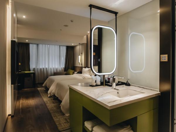 Orienwit Hotel-Free Shuttle Bus fir Canton Fair : photo 10 de la chambre chambre lits jumeaux deluxe