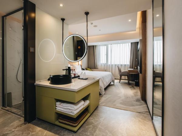 Orienwit Hotel-Free Shuttle Bus fir Canton Fair : photo 2 de la chambre chambre supérieure lit queen-size