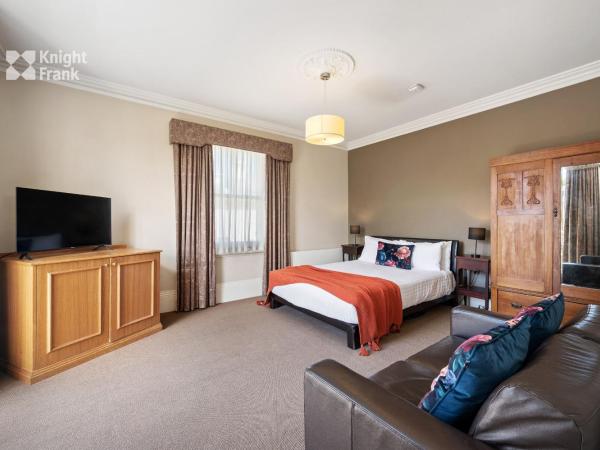 Clydesdale Manor : photo 1 de la chambre suite lit queen-size avec baignoire spa - 4