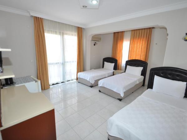 Defne & Zevkim Hotel : photo 1 de la chambre chambre triple standard