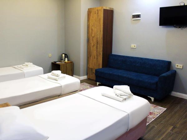 biglife hotel : photo 5 de la chambre chambre triple avec salle de bains commune