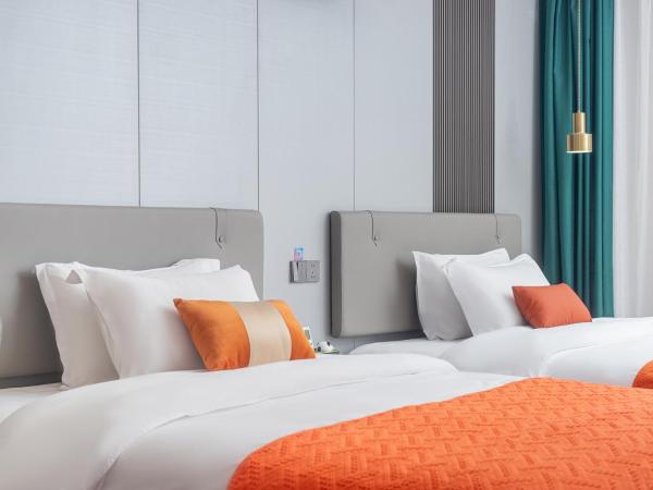 Guangzhou Yashay International Apartment - Pazhou Convention and Exhibition Centre : photo 6 de la chambre chambre deluxe avec 2 lits doubles