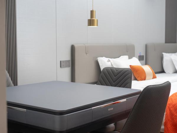 Guangzhou Yashay International Apartment - Pazhou Convention and Exhibition Centre : photo 5 de la chambre chambre deluxe avec 2 lits doubles