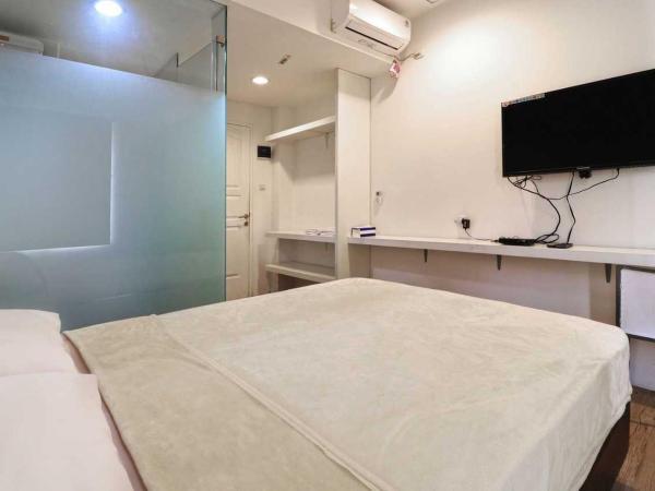 Rumah Kayu Manis Bintaro : photo 1 de la chambre chambre double standard