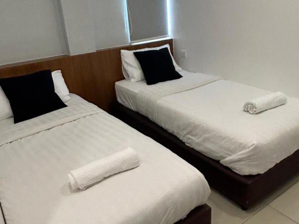 Pets and Family Guesthouse Kota Laksamana, Melaka : photo 2 de la chambre chambre lits jumeaux avec salle de bains