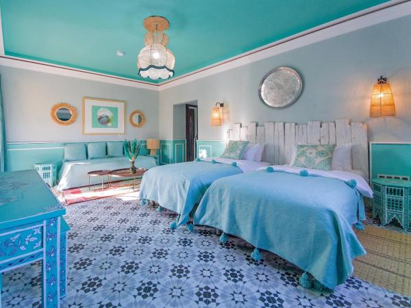 Maison Daouia : photo 1 de la chambre chambre triple - vue sur la piscine