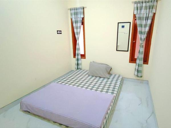 Surabaya Homey near UNAIR Syariah : photo 7 de la chambre chambre double standard avec ventilateur
