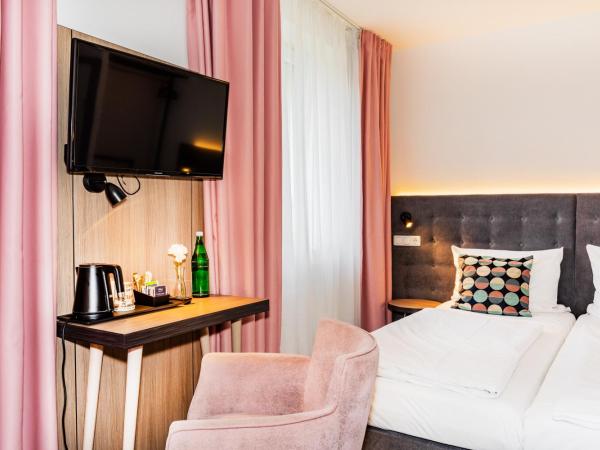 Home Hotel : photo 3 de la chambre chambre quadruple standard