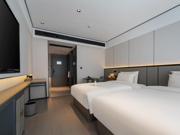 Gongxili - Xige Hotel : photo 1 de la chambre chambre lits jumeaux standard