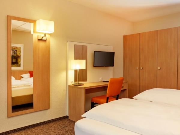 H4 Hotel Arcadia Locarno : photo 2 de la chambre chambre lits jumeaux standard