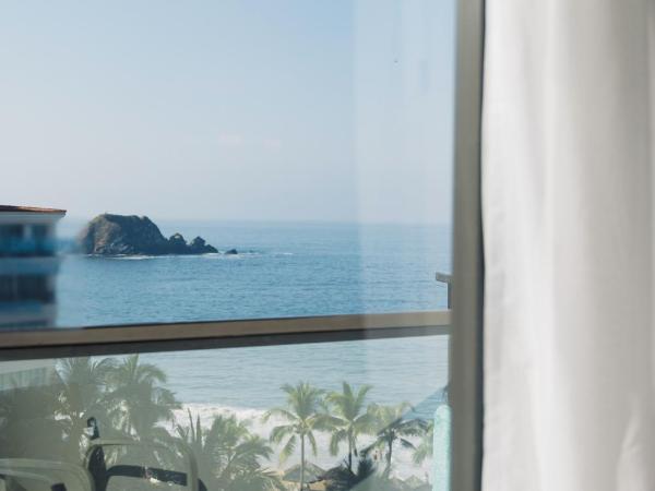 Fontan Ixtapa : photo 6 de la chambre chambre double deluxe - vue latérale sur mer