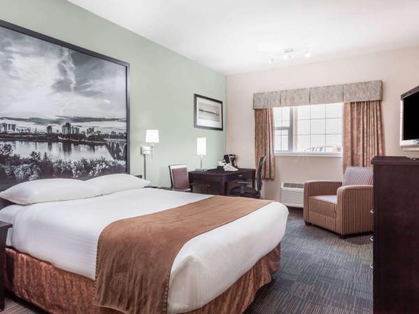 Super 8 by Wyndham Saskatoon Near Saskatoon Airport : photo 1 de la chambre chambre lit queen-size affaires - non-fumeurs