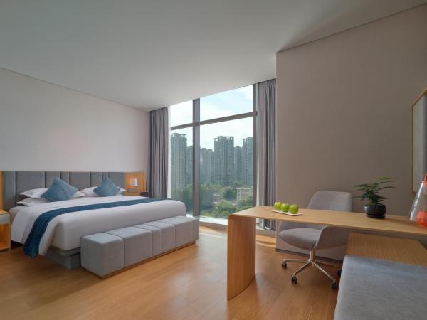 Pagoda Hotel Hangzhou Binjiang : photo 1 de la chambre chambre double deluxe avec baignoire