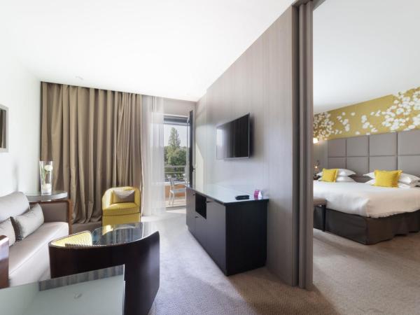 Crowne Plaza Lyon - Cité Internationale : photo 10 de la chambre suite avec canapé-lit - vue sur fleuve ou sur parc