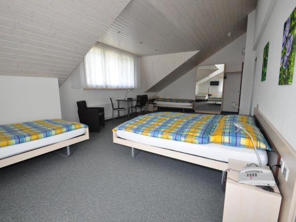 Ferien- und Familienhotel Alpina Adelboden : photo 2 de la chambre chambre quadruple