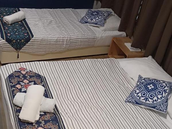 Wayton Express : photo 3 de la chambre chambre triple Économique avec salle de bains commune