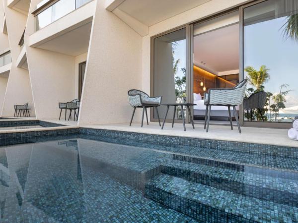 Hilton Cancun, an All-Inclusive Resort : photo 1 de la chambre chambre lit queen-size avec accès piscine - côté océan