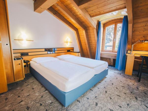 Villa Waldperlach by Blattl : photo 1 de la chambre studio lit king-size avec canapé-lit