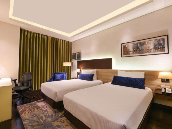 DoubleTree by Hilton Gurugram Baani Square : photo 2 de la chambre chambre lits jumeaux premium