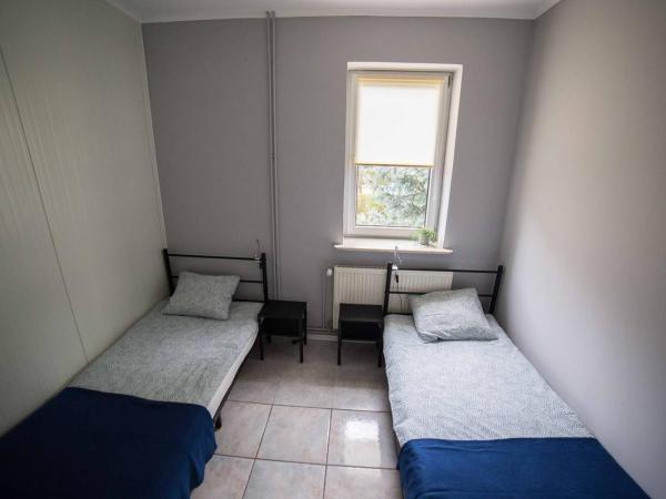 Pokoje Jaśminowa : photo 1 de la chambre chambre lits jumeaux avec salle de bains commune