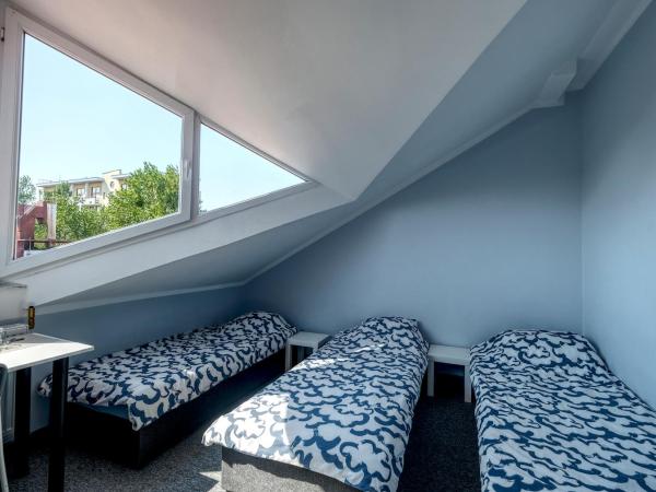 Noclegi pokoje gościnne Żeglarz : photo 1 de la chambre chambre quadruple