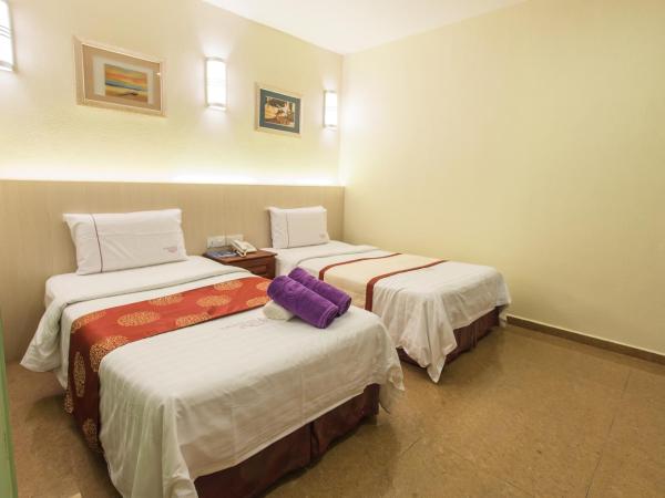 Lavender Inn Permas Jaya : photo 1 de la chambre chambre lits jumeaux supérieure