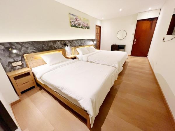 The Borneo Hotel : photo 4 de la chambre chambre triple supérieure (sans fenêtre)