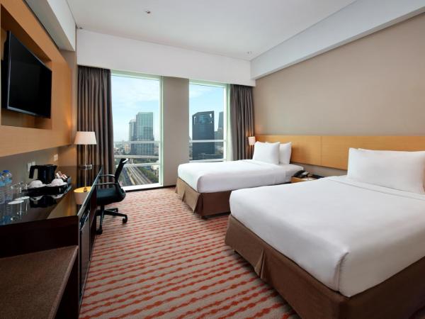 JS Luwansa Hotel & Convention Center : photo 2 de la chambre chambre deluxe double ou lits jumeaux