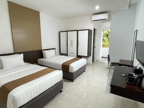 LPP Convention Hotel Demangan : photo 1 de la chambre chambre deluxe double ou lits jumeaux