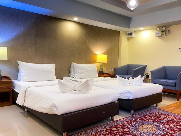 Kim Hotel At Morleng : photo 4 de la chambre chambre lits jumeaux pour personnes à mobilité réduite