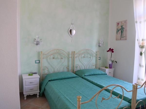 B&B Le Rose : photo 1 de la chambre chambre lits jumeaux avec salle de bains privative séparée