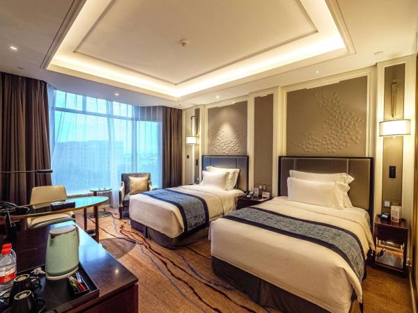 Wyndham Qingdao : photo 1 de la chambre deluxe city view room with twin bed