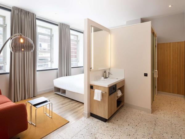 Motto By Hilton Rotterdam Blaak : photo 2 de la chambre chambre lit king-size avec canapé-lit