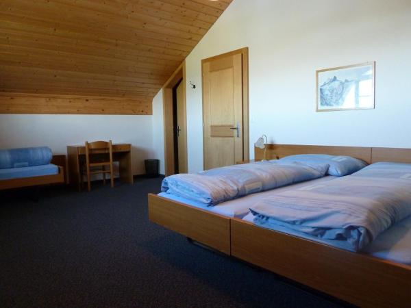 Berghaus Männlichen : photo 7 de la chambre chambre quadruple avec salle de bains privative