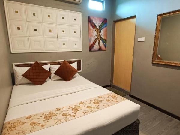 Tc theme park Guest house : photo 1 de la chambre chambre lit queen-size deluxe