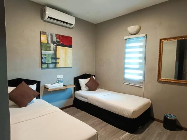 Tc theme park Guest house : photo 1 de la chambre chambre lits jumeaux Économique