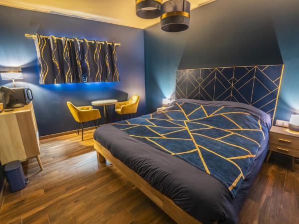 L'eSPAce détente : photo 8 de la chambre suite lit king-size avec baignoire spa