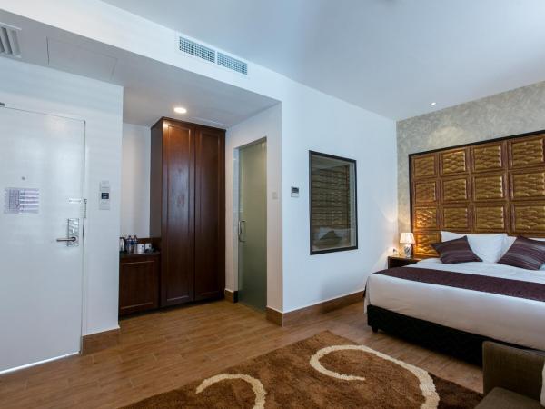 Belllo Hotel JB Central : photo 1 de la chambre suite