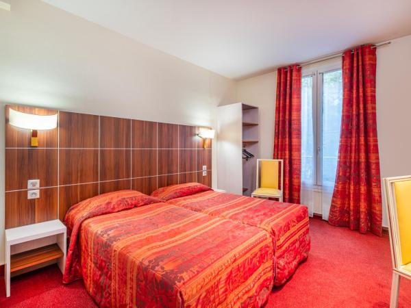 Hotel Terminus Montparnasse : photo 1 de la chambre chambre lits jumeaux supérieure sans ascenseur