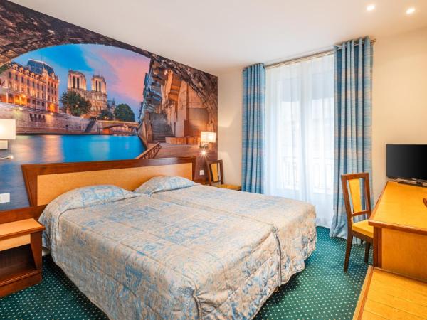 Hotel Terminus Montparnasse : photo 5 de la chambre chambre lits jumeaux exécutive