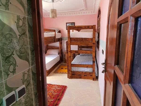 The Sunrise Villa : photo 3 de la chambre chambre quadruple - vue sur jardin