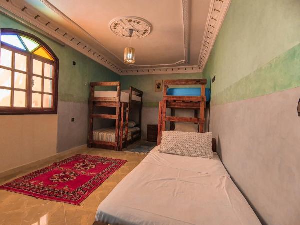 The Sunrise Villa : photo 7 de la chambre chambre familiale - vue sur jardin