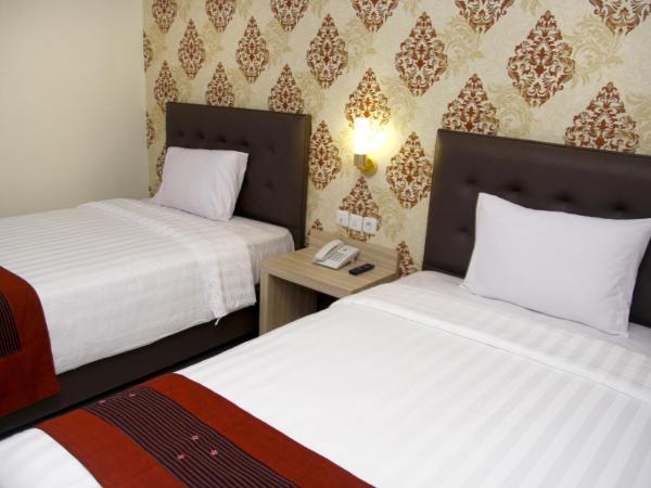 Hersya Front One Inn Surabaya : photo 4 de la chambre chambre lits jumeaux supérieure