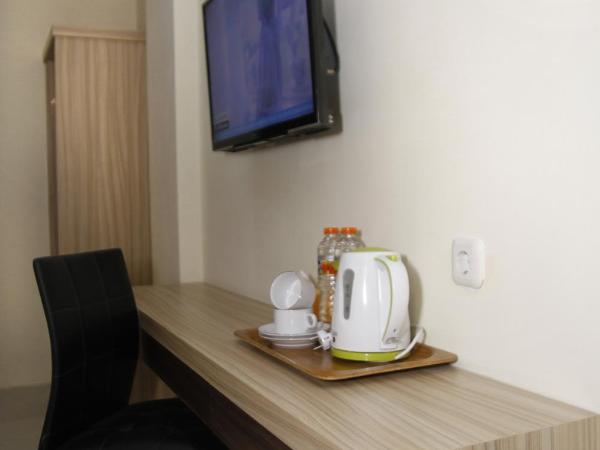 Hersya Front One Inn Surabaya : photo 2 de la chambre chambre lits jumeaux deluxe